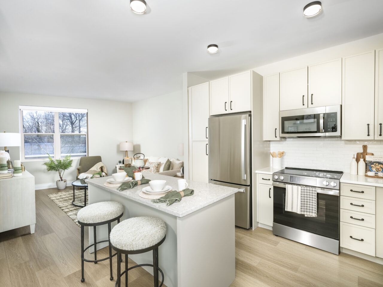 Photo of kitchen inside of a model home at Modera Falls Church, featuring modern finishes